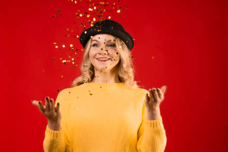 Winter holiday, a young woman in knitted clothes and a bowler hat
