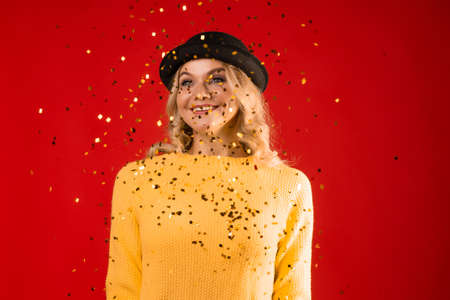 Winter holiday, a young woman in knitted clothes and a bowler hatの写真素材