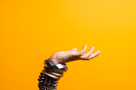 Hand gestures. Womens hand with lots of bracelets, youth fun style.