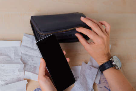 Personal finance, a woman holds a wallet in her hands and counts money,