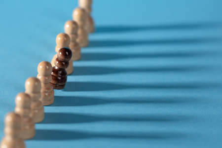 chess pieces in a row, white pawns on a blue background,の写真素材