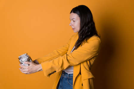 Financial savings, concept on a yellow background.の写真素材