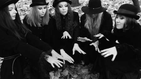 Coven of witches, modern witches gathered and do a ritual in the Park.の写真素材