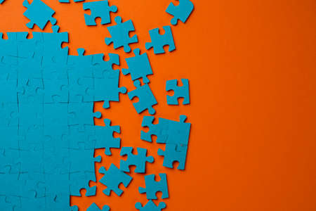 A set of puzzles, the process of collecting in a large pattern. Teamwork and problem solving, concept.の写真素材