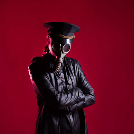 An evil Character in black leather clothes and a military capの写真素材