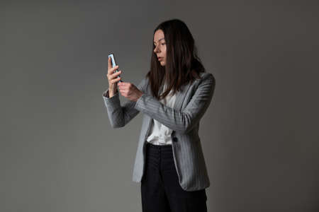 businesswoman dressed in a jacket and trousers in a casual styleの写真素材