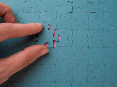 Solving the problem, successfully completed collecting puzzles. The fingers insert the final element...