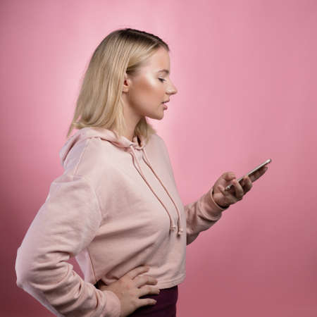 Modern online communication in messengers, correspondence applications. An attractive young woman in...
