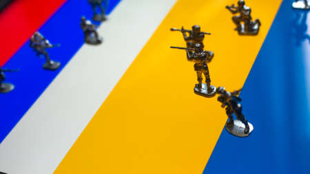 The concept of the economic and political crisis between Russia and Ukraine, toy soldiers attacking...