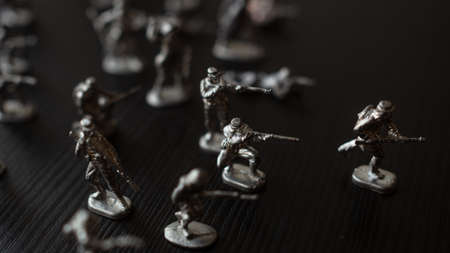 The concept of war and confrontation, political crises, toy tin soldiers attacking each otherの写真素材