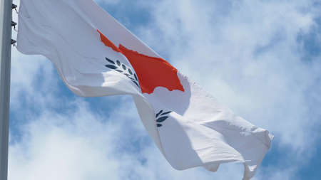 Cyprus, flag is fluttering in the wind photo on the background of the sky, outdoors. National flagの写真素材