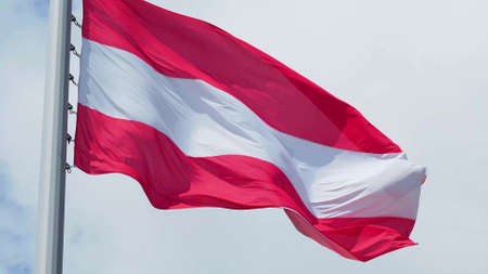 Austria, flag is fluttering in the wind photo on the background of the sky, outdoors. National flagの写真素材