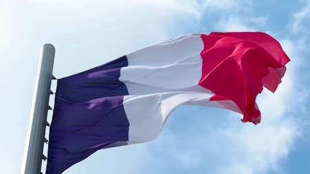 France, flag is fluttering in the wind photo on the background of the sky, outdoors. National flagの写真素材