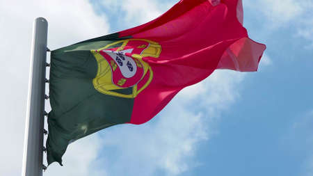 Portugal, flag is fluttering in the wind photo on the background of the sky, outdoors. National flagの写真素材