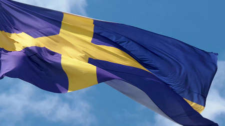 Sweden, flag is fluttering in the wind photo on the background of the sky, outdoors. National flagの写真素材