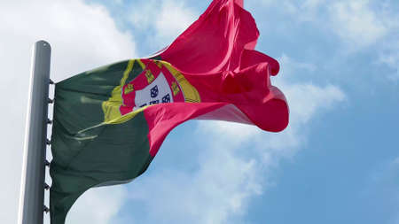 Portugal, flag is fluttering in the wind photo on the background of the sky, outdoors. National flagの写真素材