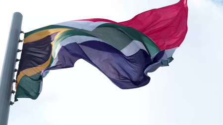 South Africa, flag is fluttering in the wind photo on the background of the sky, outdoors. National flagの写真素材