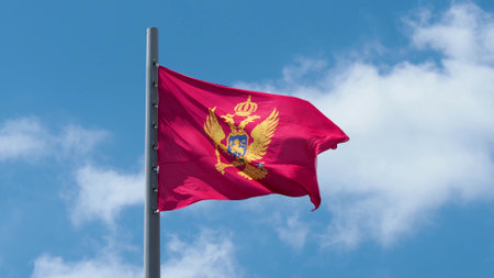 Montenegro, flag is fluttering in the wind photo on the background of the sky, outdoors. National flagの写真素材