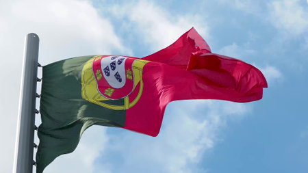 Portugal, flag is fluttering in the wind photo on the background of the sky, outdoors. National flagの写真素材