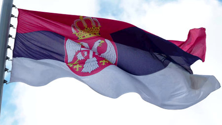 Serbia, flag is fluttering in the wind photo on the background of the sky, outdoors. National flag
