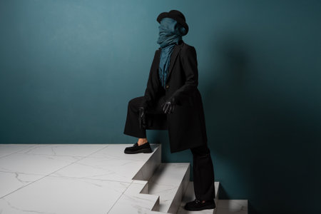 Unknown. Nobody, the concept of the identity crisis. An impersonal person. A person in a coat and hat, face hidden.の写真素材