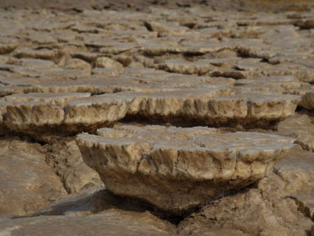 Closeup of rock patterns dried earth forming a Mars like landscape in Danakil Depression in...