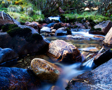 Slow-motion time-lapse of blurry running water landscape river and green rainforest along Santa Cruz Trek near Huaraz, Peru.の写真素材
