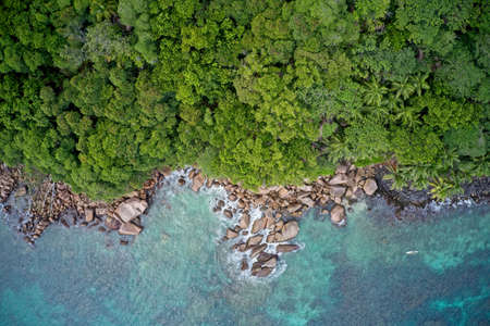 Drone field of view of sea and coastline with natural background forming patterns in nature, Praslin Island, Seychelles.の写真素材
