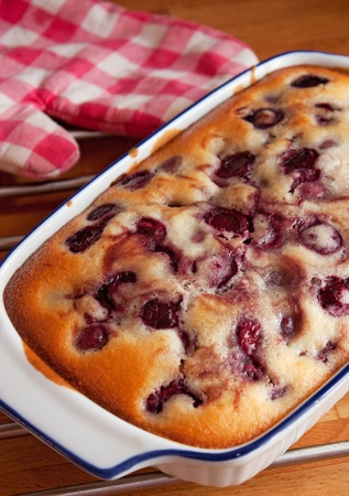 Delicious homemade cake with seasonal cherriesの写真素材