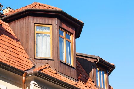 Tiled roof and wooden windowsの写真素材
