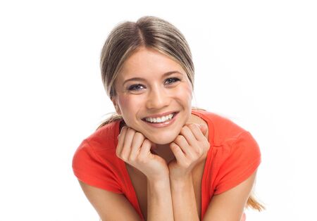 Closeup portrait of a cheerful young woman の写真素材