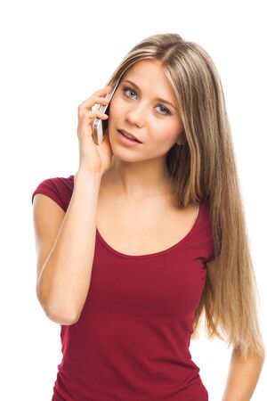 Young woman talking on the phone, on whiteの写真素材