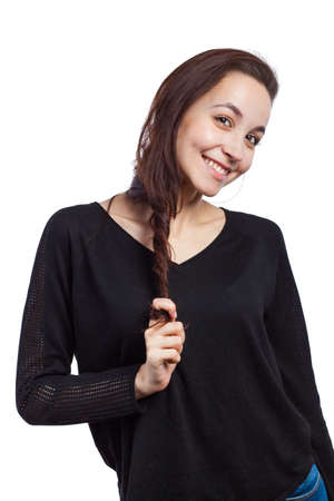 Portrait of a beautiful young woman pulling her hair, isolated on white