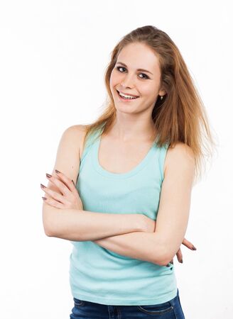 Portrait of a cheerful woman standing, isolated on whiteの写真素材