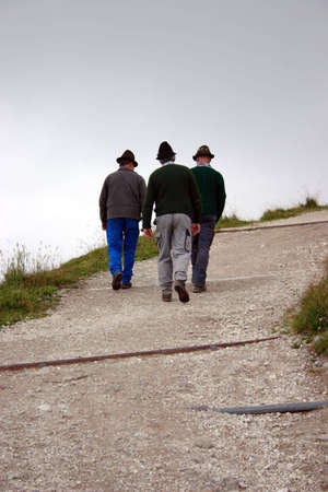 Bavarians walking up hillの写真素材