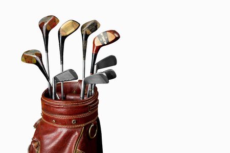 Vintage worn Golf clubs in an old bag isolated over a white background の写真素材