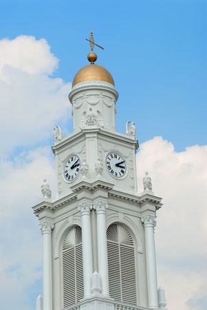 clock tower with copper weather vane and copper dome