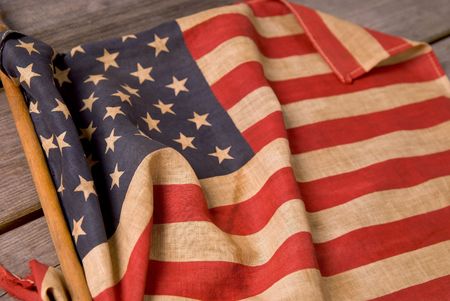 detail of a vintage american flag on a wood table