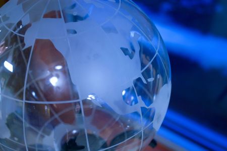 Glass globe under blue light sourceの写真素材