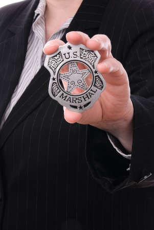 Police detective showing her badgeの写真素材