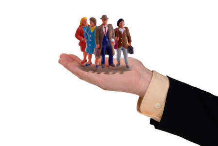 Business man with an open hand filled with business people isolated on whiteの写真素材