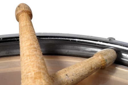 close up top view of a snare drum with drum sticks