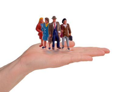 Business woman with an open hand filled with business people isolated on whiteの写真素材