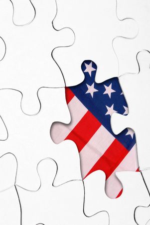 puzzle missing one piece with US flag in the background of the empty spaceの写真素材