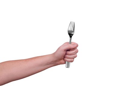 Fork held by a woman's hands isolated over whiteの写真素材