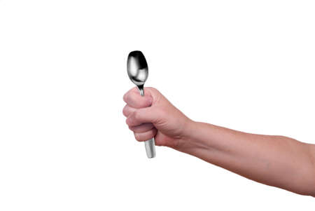 Spoon held by a woman's hands isolated over whiteの写真素材
