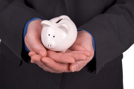 Businesswoman holding a Piggy-bank in her handsの写真素材