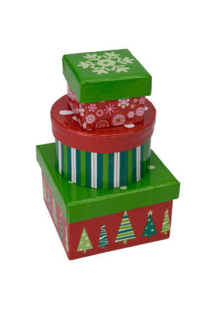 Gift boxes wrapped in colorful paper stacked isolated over white