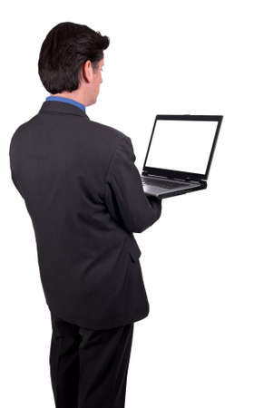 Businesswoman holding a laptop isolated over whiteの写真素材
