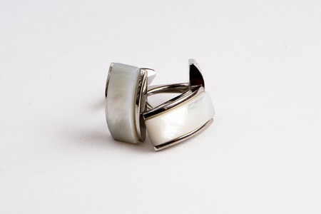 Elegant cufflinks made of metal and pearlの写真素材